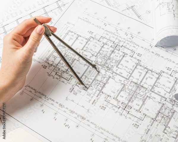 Fototapeta Architect working on blueprint