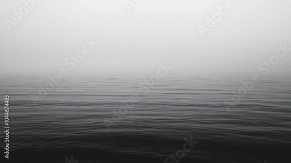 Fototapeta Calm, still water surface obscured by dense fog.
