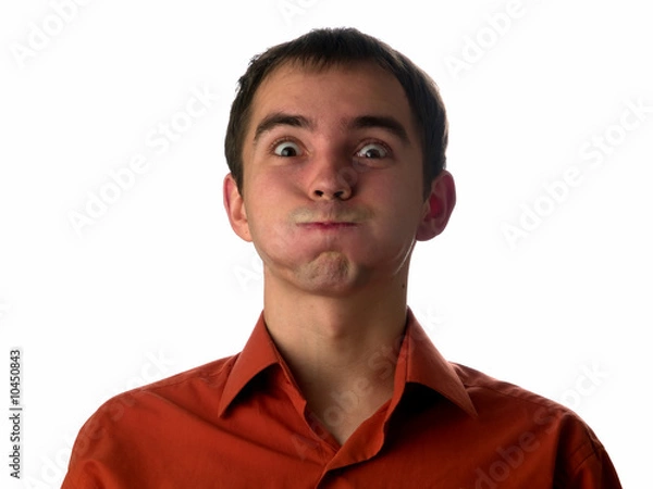 Fototapeta Stupid face expression young man looking camera