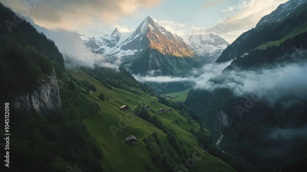Fototapeta A mountain range with a village in the valley