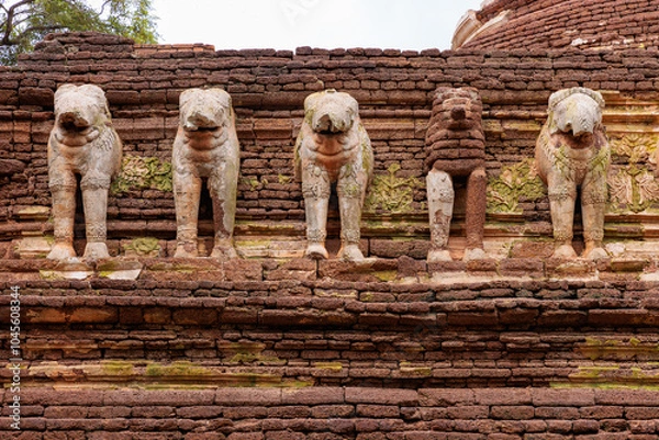 Fototapeta Close up of elephant wall at Wat Chang Rob temple in Kamphaeng Phet Historical Park, UNESCO World Heritage site, popular destination of tourist in Kamphaeng province, Northern of Thailand