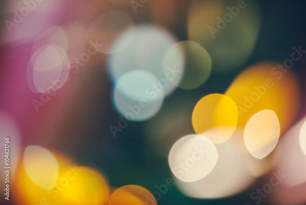 Fototapeta abstract background with bokeh defocused lights and shadow from christmas night party, vintage or retro color tone