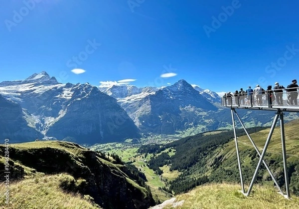 Fototapeta View of Bernese Alps at Grindelwald First in Switzerland showing stunning peak views of the Eiger Mountain and Wetterhorn Mountain