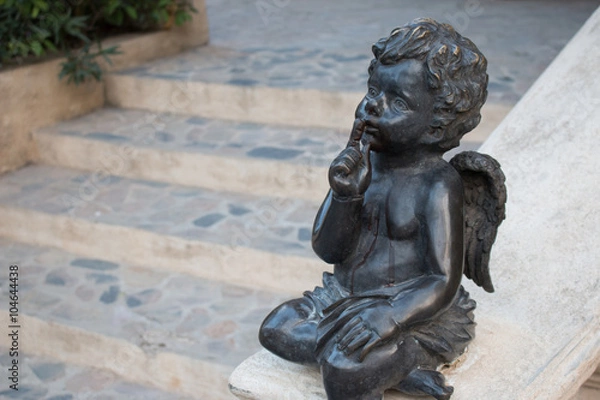 Fototapeta Cupid statue sitting