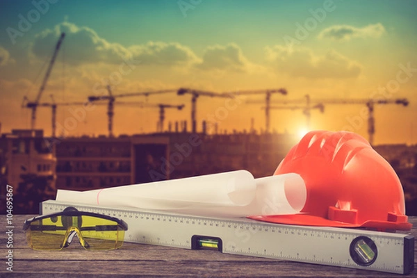 Obraz engineer working table plan and blueprint at building constructi