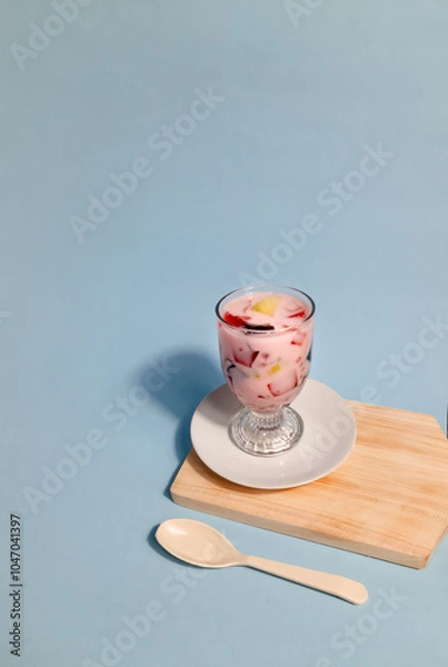 Fototapeta Es buah or Sop buah with fresh fruit filling and agar and cincau, mixed with syrup and ice cubes. suitable for hot weather, refreshment