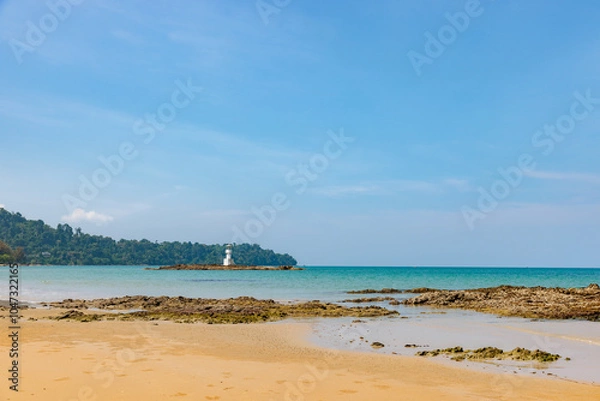 Fototapeta A Lighthouse on the beautiful beach with blue sky in Khao Lak, a destination of tourist in  Phang-Nga province, Southern of Thailand