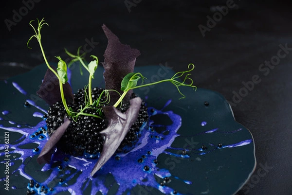 Obraz Risotto with cuttlefish ink and black caviar