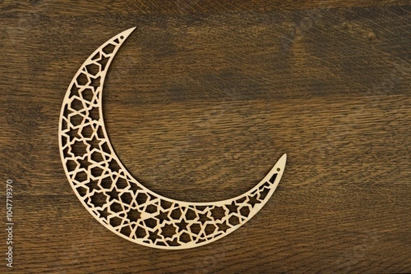 Obraz Islamic pattern crescent moon  with laser carved wood on brown wooden background .