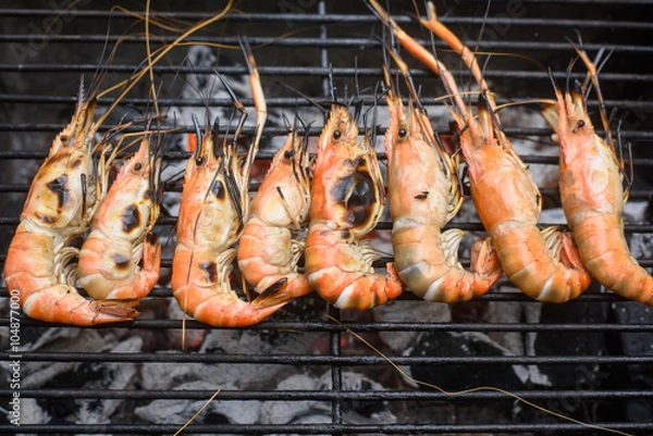 Obraz Grilled shrimps on the flaming grill.