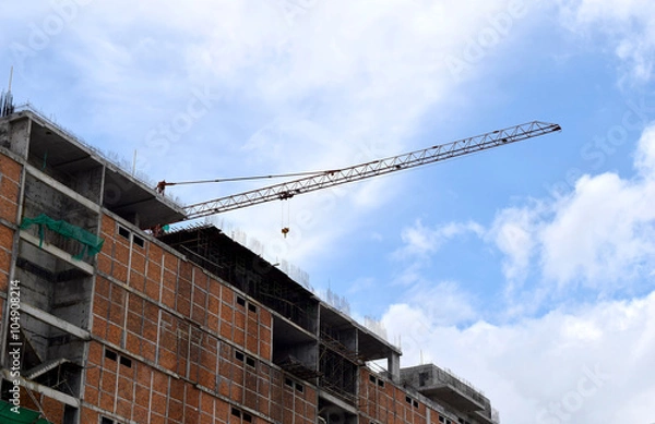 Fototapeta Construction cranes and Buildings and sky background