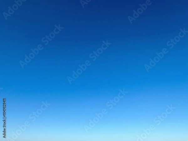 Fototapeta Sky gradient. Bright blue summer cloudless sky on a sunny day, sky blue gradient, background, backdrop, desktop.