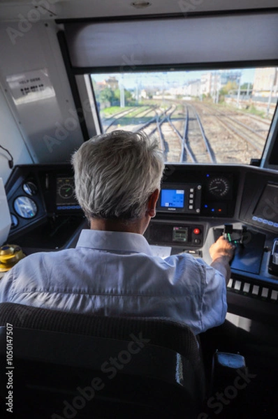 Obraz a train driver driving a regional train