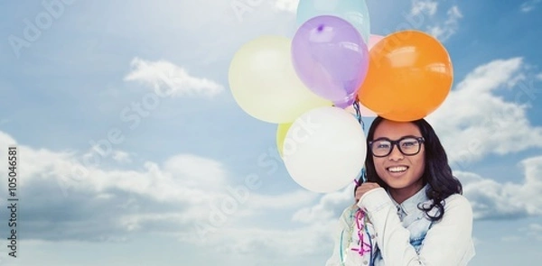 Fototapeta Composite image of asian woman holding colorful balloons