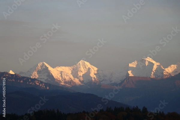 Obraz Famous Eiger, Monch and Jungfrau in special lighting conditions in autumn