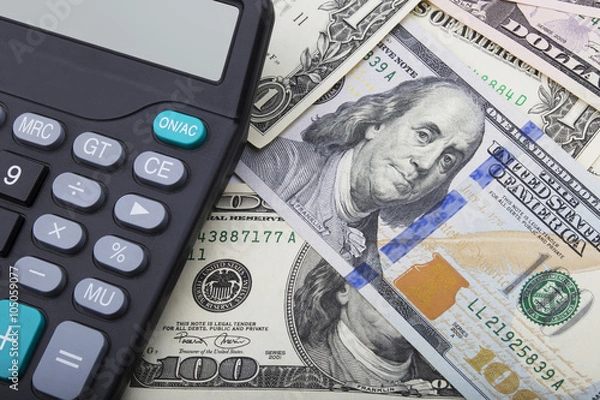 Fototapeta USD bank notes and a calculator