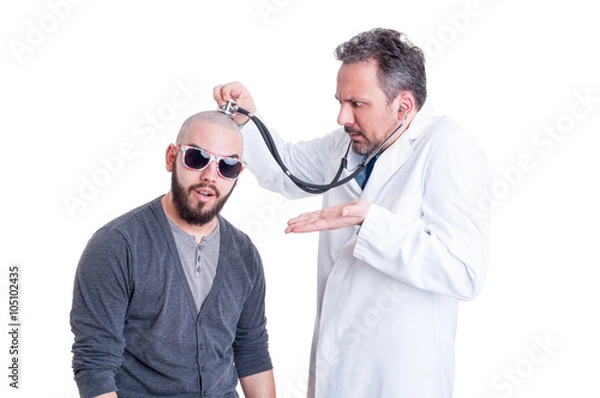 Obraz Funny doctor checking a silly patient with head problem