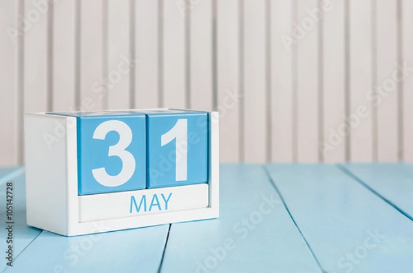 Fototapeta May 31st. Image of may 31 wooden color calendar on white background.  Last spring day, Spring end. Empty space for text. World blondes Day