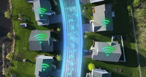 Obraz Suburban homes with Wi-Fi symbols projected on rooftops and digital fiber optics stream between houses. Technology concept. Aerial