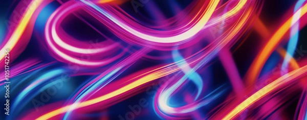 Fototapeta Colorful swirling light trails create a vibrant abstract design with energetic motion set against a dark background