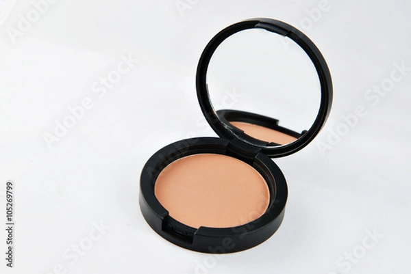 Fototapeta Compact powder for the face, in a black round box with mirror.