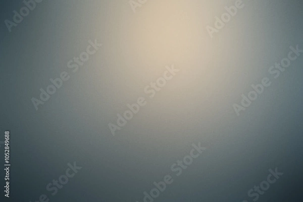 Fototapeta A blurry gray background with a yellow spot in the middle. Noisy background with grain