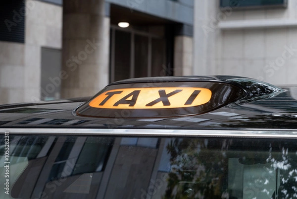 Fototapeta Taxi sing on the new electric cab in London