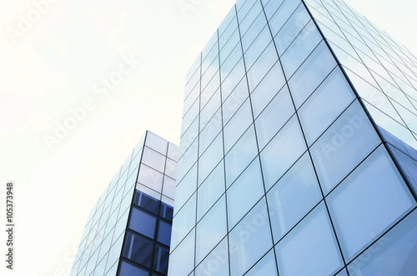 Fototapeta Bottom view of Skyscrapers. Sunset light, Blue sky, horizontal mockup. 3d render