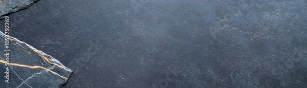 Fototapeta Close-up of textured dark slate stone surface with unique patterns, ideal as a background for design projects or presentations.