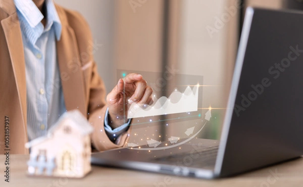 Obraz businessman points out,graph rising, about real estate Financial success,and growth, of a business, rising wealth,and economic progress, stocks, funds, and more sales, currency exchange rate concept.