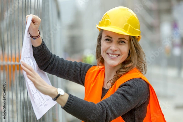 Obraz Young attractive smiling female engineer on construction site