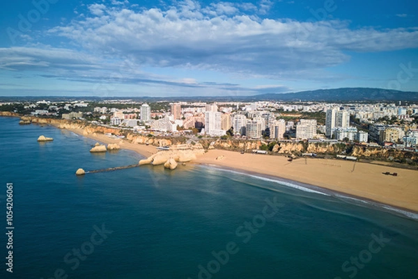 Fototapeta Aerial view of Portimao city and its famous beach Praia Da Rocha  in autumn, Portugal