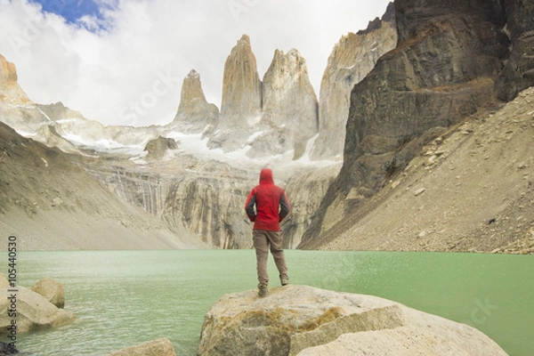 Obraz man standing near lake in patagonia, torres del paine