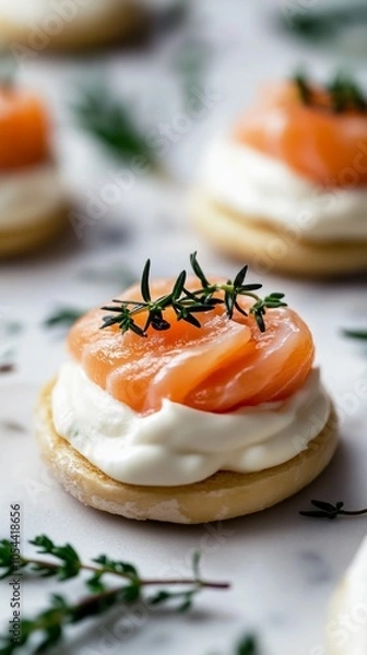 Fototapeta Gourmet salmon canapé with cream cheese and thyme on marble table