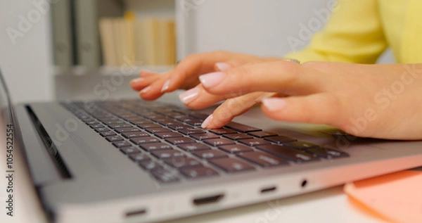Fototapeta Hands of professional business woman typing on laptop notebook keyboard. Working remotely from home office on software apps. Technology concept.