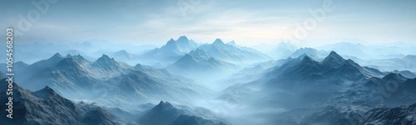 Fototapeta Mountains covered in snow and fog with a sky background