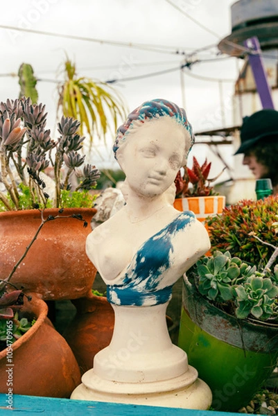 Fototapeta Statue bust in a rooftop garden in Portugal