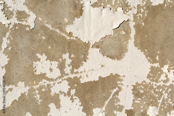 Fototapeta Close-up of a weathered concrete wall with peeling white paint abstract textured background