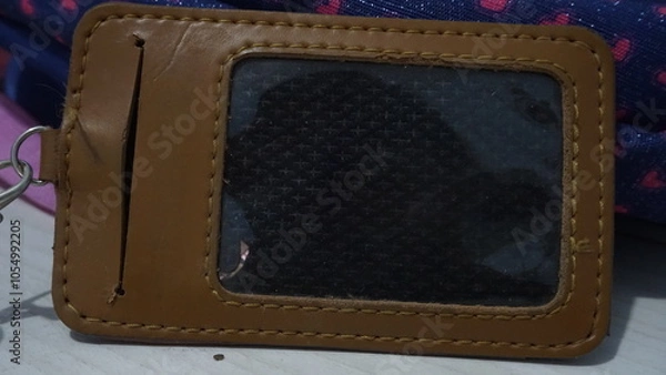Fototapeta A brown nametag holder located on the table
