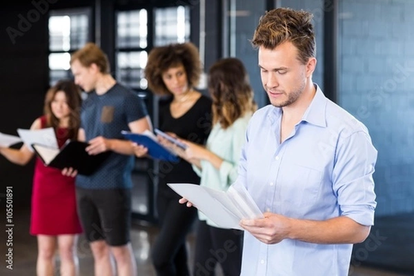 Fototapeta Man looking at document 