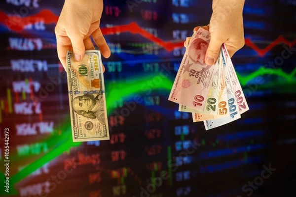 Fototapeta American dollar and Turkish lira on woman's hand and stock market screen, money chart background