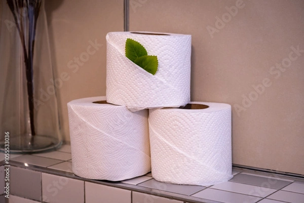 Fototapeta Stack of white toilet paper sitting on a shelf