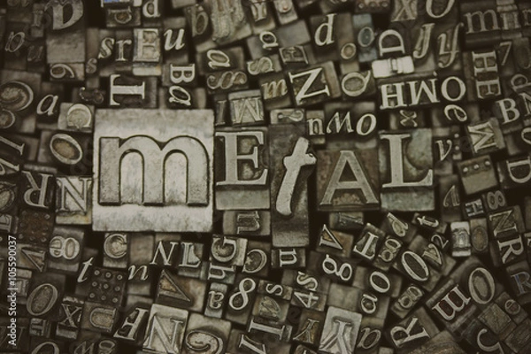 Fototapeta Close up of typeset letters with the word Metal