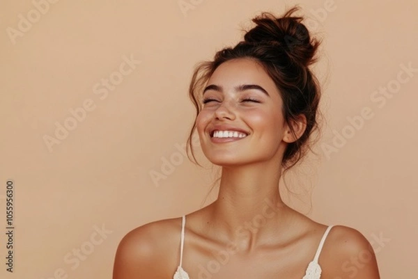 Fototapeta A young woman with a joyful expression and natural makeup smiles warmly. She exudes happiness and confidence, capturing a moment of genuine emotion and positivity. Generated AI