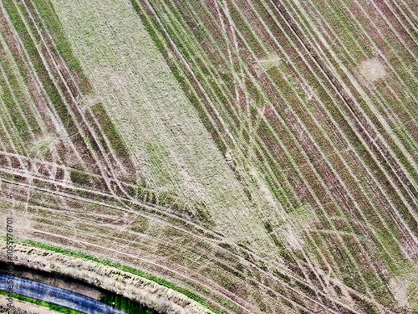 Obraz aerial view of arable lowland agricultural field with intersting patterns of plough marks
