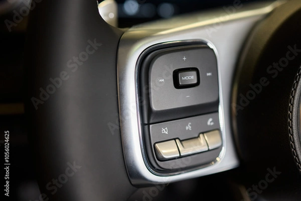 Fototapeta The modern cars steering wheel control panel boosts convenience and performance