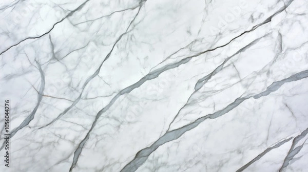Fototapeta White marble surface with natural gray and black veining patterns, illustrating the intricate texture and elegance of the marble material.