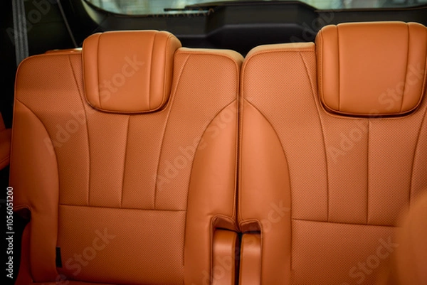 Fototapeta Indulge in Luxurious Orange Leather Car Seats that feature a Unique and Stylish Design
