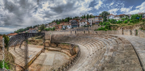 Fototapeta Panoramic view of Antique ancient theater in Ohrid. It was built more than two millennia, sometime at the end of 3rd or the beginning of 2nd century. A famous tourist spot. It is used now for concerts