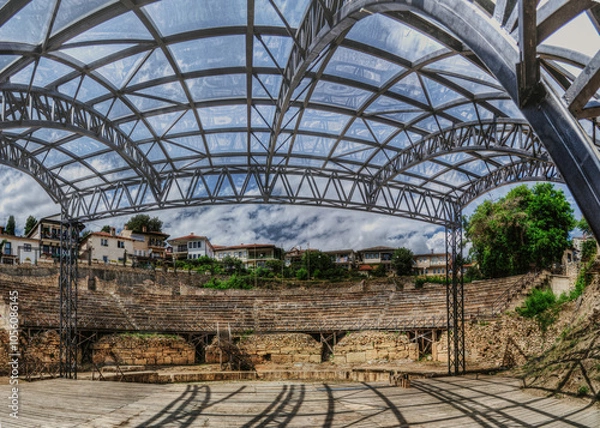 Fototapeta Panoramic view of Antique ancient theater in Ohrid. It was built more than two millennia, sometime at the end of 3rd or the beginning of 2nd century. A famous tourist spot. It is used now for concerts